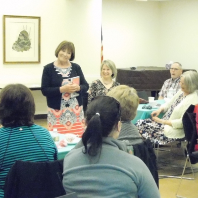 Tea with One Braintree, One Book 2018 Author Leslie Meier One Braintree, One Book 2018 Author Leslie Meier speaking to group at a tea time