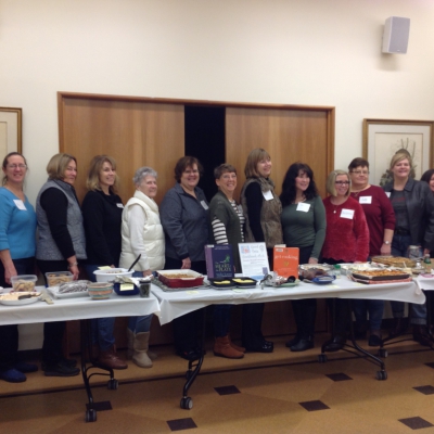 Good Taste Cookbook Club Group photo of 15 women in the Good Taste Cookbook Club