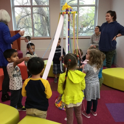 Children around maypole in Children's Room