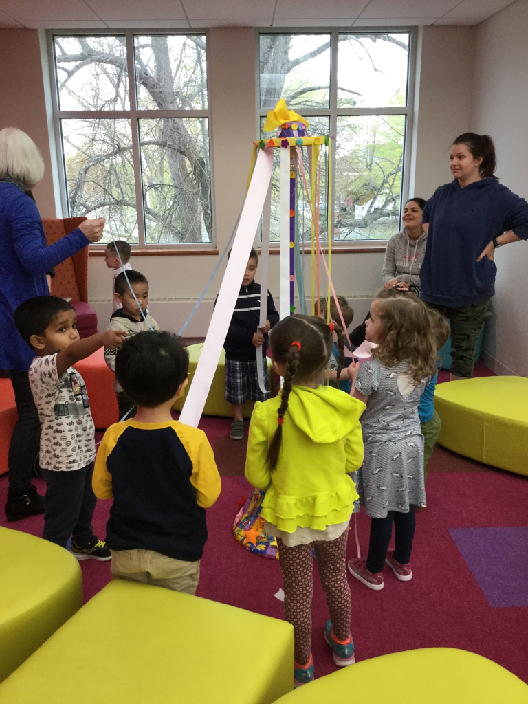 Maypole Storytime Children around maypole in Children's Room