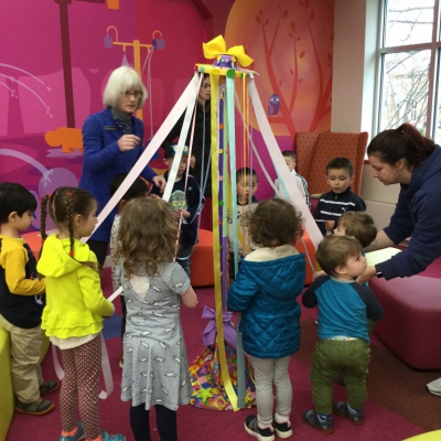 Children around maypole in Children's Room