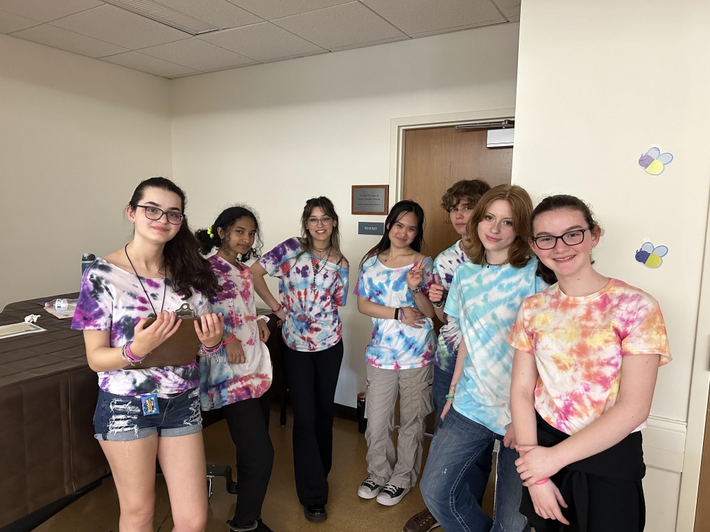 Teen volunteers Group photo of young teens wearing tie-dyed shirts